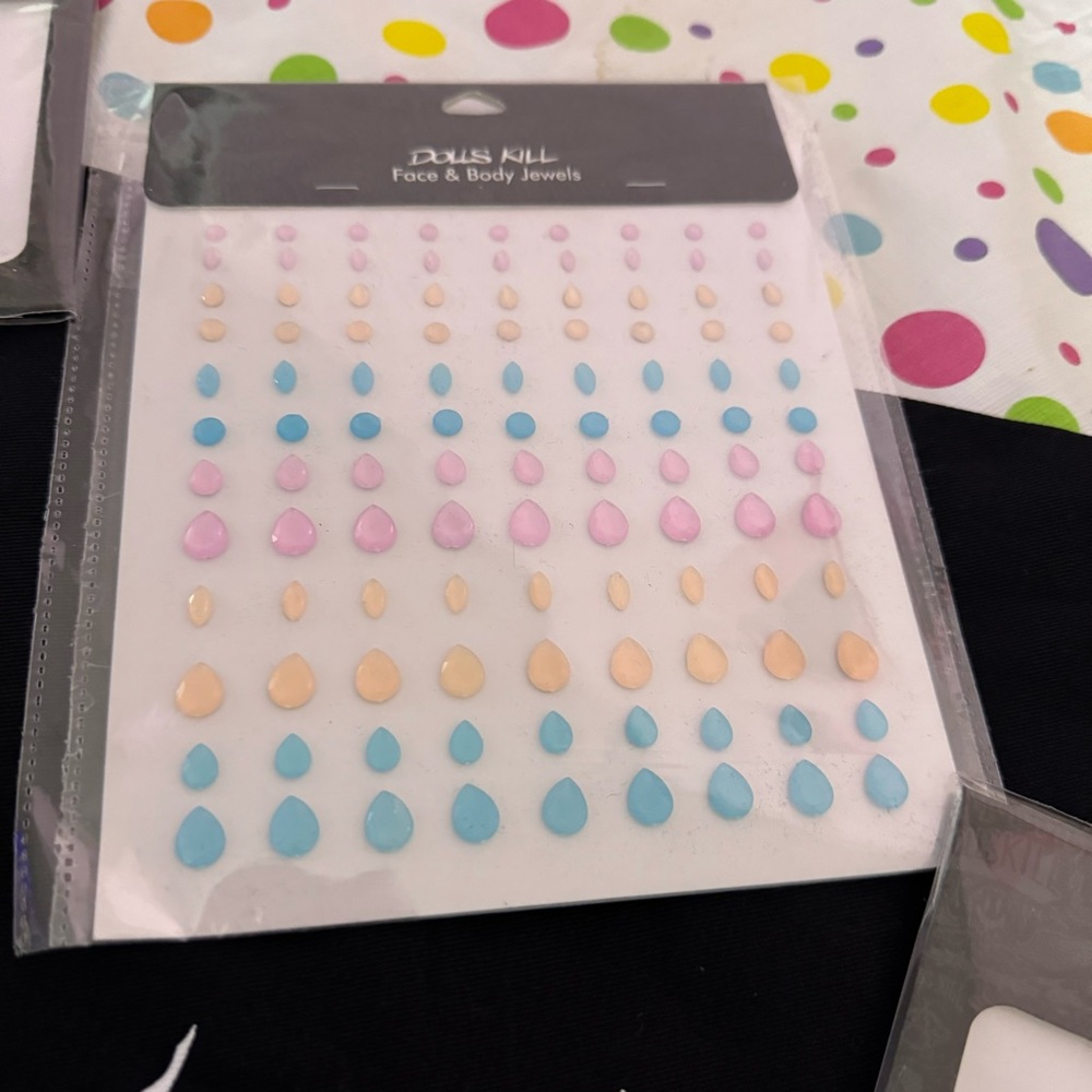 dolls kill pink blue and peach face and body gems